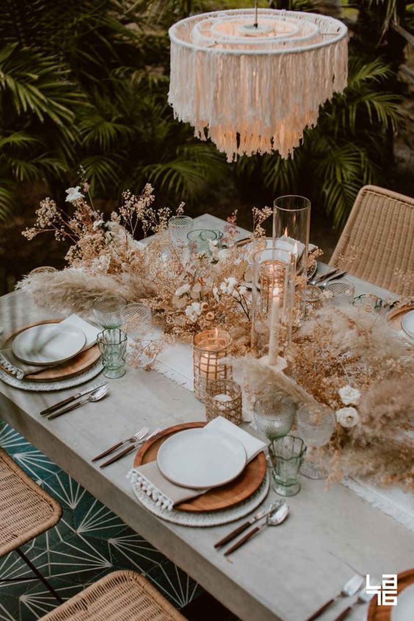 Lovely Bohemian Wedding Decoration Ideas  Boho tablescape with wooden plates, a fringe chande... -   15 wedding Bohemian reception ideas
