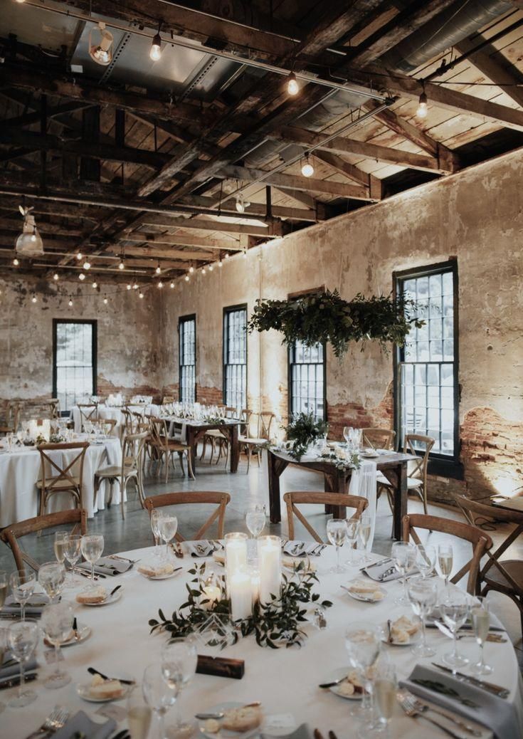 industrial bohemian wedding reception in brick building. Round tables, greenery,... -   15 wedding Bohemian reception ideas