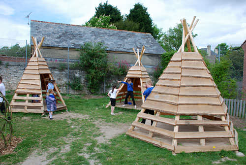 12. Pallets + Logs = Teepee -   25 Outdoor Play Areas For Kids Transforming Regular Backyards Into Playtime Paradises